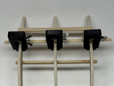 5 Piece Hull Planking Clamps For Wooden Model Ship Kit With Frame Plank Holder Tool Wingnut Tightening Keeps Your Hull Secure Without Marking Pro Grade PETG 3D Printed Flexible Clamp Set For Ship Builders showing three clamps on frame