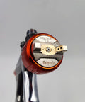 Close-up of 1.3 mm nozzle on the Hardcore Low Pressure Pneumatic Spray Gun Handles Automotive Bodywork And Furniture Grind With A Spacious 600 Ml Cup And Precision 1.3 Mm Nozzle For Zero Hassle Application Of Sleek Silver Paint.