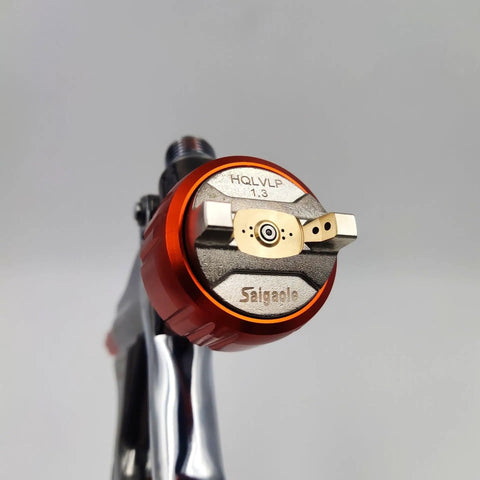 Close-up of 1.3 mm nozzle on the Hardcore Low Pressure Pneumatic Spray Gun Handles Automotive Bodywork And Furniture Grind With A Spacious 600 Ml Cup And Precision 1.3 Mm Nozzle For Zero Hassle Application Of Sleek Silver Paint.
