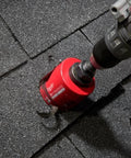 Close-up Milwaukee 4-1/4 in Big Hawg carbide hole saw attached to a drill outdoors