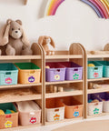 90Pcs Hibiscus Flower Name Tag Stickers Set With 9 Dope Styles on colorful storage bins in a kids' playroom with shelves.