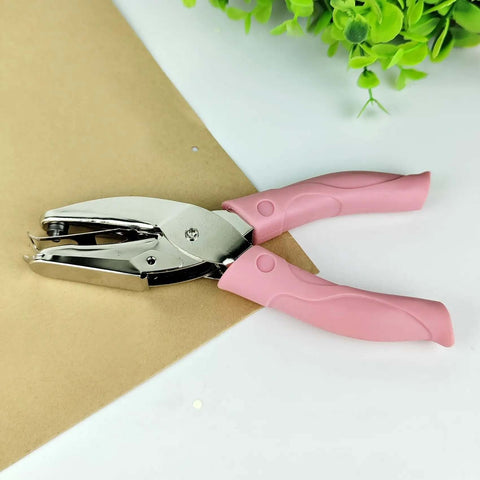 Handheld Circle Hole Punch One Ninth Inch Three Mm, pink handle, on brown paper, Single Hole Paper Punch, Easy Grip Craft And Office Tool