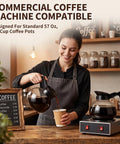 Pro Level Thermal Resistant Glass Coffee Pots 4 Pack 10 Cup 57 Oz Replacement Carafes For Commercial Brewers With Slick Black Handles in use while pouring coffee.