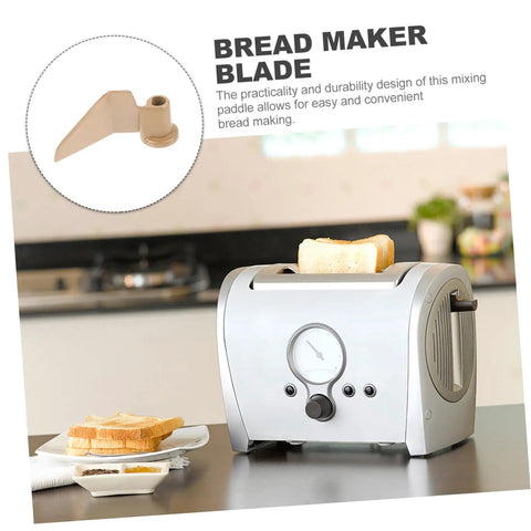 Stirring Paddle Replacement For Bread Maker Reusable Kneading Mixer Blade Spare Part shown next to a silver bread machine in kitchen.
