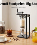 Heavy Duty Manual Cup Sealer For Soda And Tin Cups Knocks Spills Flat With A Precision Roller That Locks Freshness In Fast And Cranks Ten Drinks Each Minute For Shops Demanding Game Changing Performance Zero Hassle on a countertop with drinks.