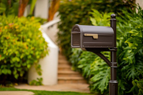 Mapleton Heavy Duty Steel Post Mounted Mailbox For Outdoor Use In Rubbed Bronze Finish in garden by walkway