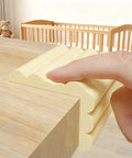 Finger pressing Soft Auto Adhesive Furniture Corner Protector for Edges Baby Proof Corner Guard on table edge for safety.