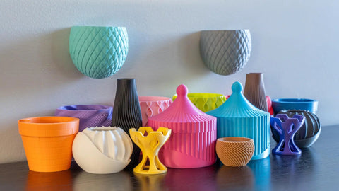 Polymaker Panchroma Matte PLA filament samples: assorted colorful 3D-printed objects on a table