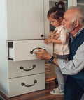 Grandfather and granddaughter using Vintage Zinc Alloy Cabinet Pull Handles 4 Pack for Furniture Doors and Drawers on white dresser.