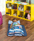 Child sleeping on Nap Mat For Toddlers With Removable Pillow Fire Police Rescue Theme Roll Up Design in daycare setting
