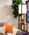Maxwell Dope Modern Shelf Floor Lamp With Shade And Warm White LED Bulb beside living room sofa, Havana Brown finish.