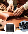 Craftsman using Leather Circle Cutter Tool Set With 31 Circle Punch Dies for DIYers and leather pros, includes cutting board.