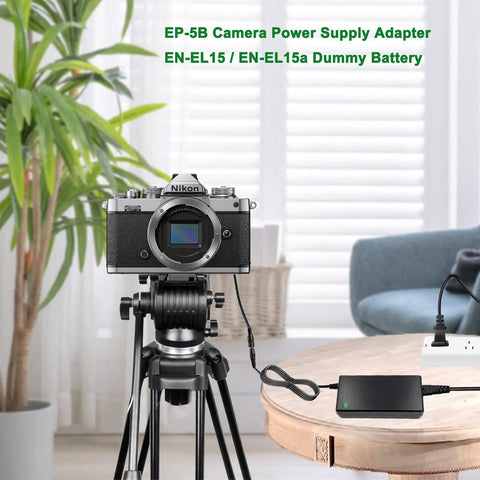 Nikon camera connected to EN-EL15 Dummy Battery And Power Supply Kit For Nikon Cameras EP-5B AC Adapter on tripod in living room.
