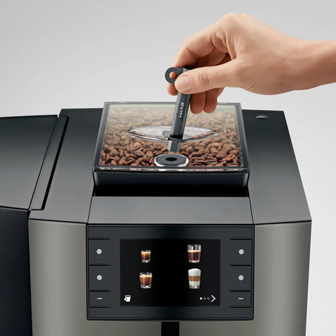 Premium Top Shelf Fully Automatic Coffee Machine Featuring Cold Brew Options And Thirty Four Recipes With Smart Touchscreen, showing coffee beans and touch control.