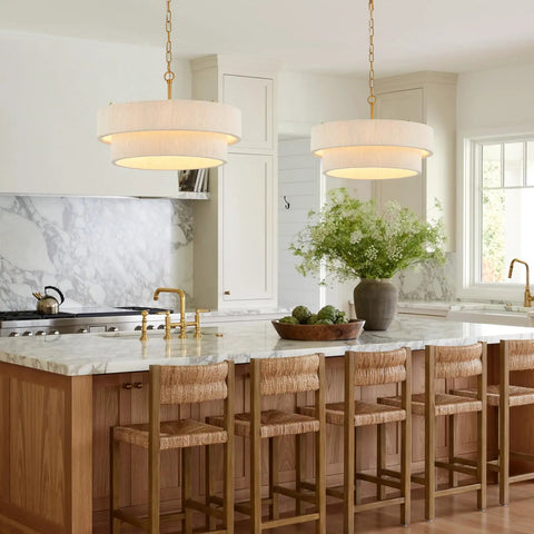 Hand Woven Rattan Chandelier Serving Real Boho Vibes And Adjustable Coastal Design over a kitchen island with marble countertop.