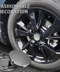 Clean 4 Piece Silver Wheel Center Caps Boast A Snappy Snap Fit And Bulletproof Abs Shield To Shut Out Road Gunk Beat Rust On Hub Studs And Keep Your Rims Looking Fresh On Daily Cruises. Close-up of a shiny silver wheel center cap beside a black alloy wheel.