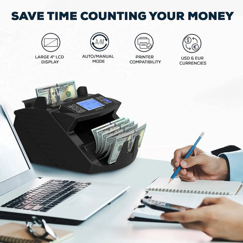 Pro Grade Money Counter Machine With Value Count And 4 Inch LCD Display next to open laptop on office desk