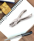 Seventeen Piece One Eighth Inch Circle Hole Punch Set for crafts on a desk with notepad and pen, durable metal construction