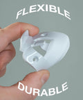 Premium Door Silencer Strike Plate That Cuts Latch Noise And Makes Slamming Chill Out Daily For Zero Stress Home Habits With Durable Flexible Rubber Mounts And Quick One Step Install, held in hand.
