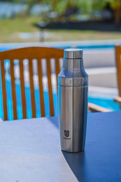 Hybrid Cocktail Shaker Set With Vacuum Insulated Double Wall Stainless Steel Construction 30oz Martini Shaker on patio table