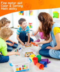 Children using Super Cool Rainbow Counting Bears Set Sixty Bright Plastic Bears And Matching Sorting Cups in a preschool setting.
