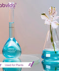 Lab glassware with blue liquid and flower, not 4 Piece Narrow Mouth Glass Erlenmeyer Flask Shot Glass Set, 50ml Each, 3.3 Borosilicate Glass