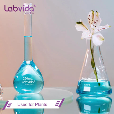 Lab glassware with blue liquid and flower, not 4 Piece Narrow Mouth Glass Erlenmeyer Flask Shot Glass Set, 50ml Each, 3.3 Borosilicate Glass