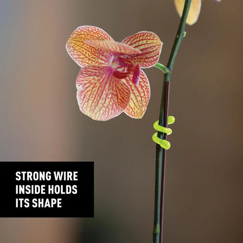 Green Gear Tie 3 Inch Reusable Rubber Twist Tie securing flower stem highlighting strong wire and grip.