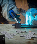 Close-up of Three Style Aluminum Welding Coupon Set For One Point Five Inch Practice Plates, DIY Dice Shapes visible.