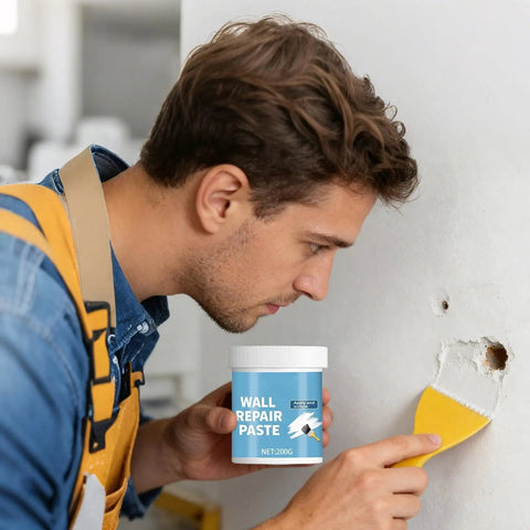 Man applying Wall Repair Paste For Quick Fix And Seamless Finish, Waterproof Drywall Crack Filler For Home Renovation, 200g, to a wall hole.