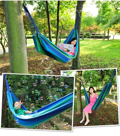Durable Portable Cotton Hammock For Camping And Outdoor Indoor Use with a person lounging among trees
