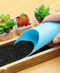 Go-To Reusable Plastic Garden Shovel Cup For Bonsai And Potted Plants 16x6 cm Cultivation Tool Spade Soil Scoop For Succulents And Fleshy Plants Handy Garden Care Essential For Plant Lovers. Blue plastic scoop pouring soil into bonsai tray