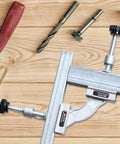 Solid As A Rock Stainless Steel Tube Clamp Heavy Duty Precision Positioning Jig For Welding And Fabrication Built Tough To Lock Your Pieces Down Securely Every Time on wooden surface with tools.