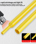 Yellow heat shrink tubing being heated, showing shrinkage process in 164 Piece Heat Shrink Tubing Kit 2 To 1 Insulation For Wires And Cables.