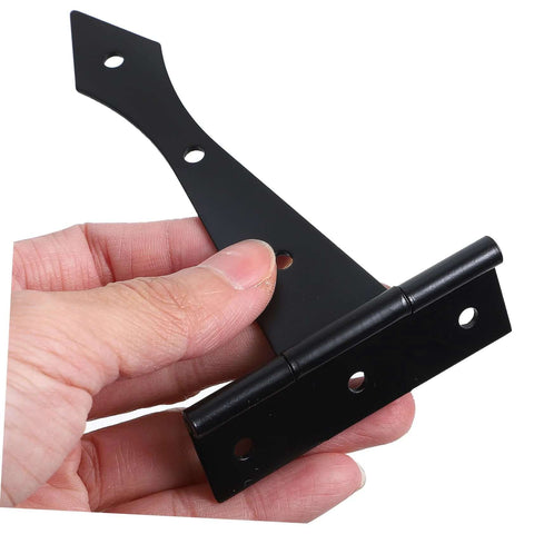 Hand holding heavy duty cabinet door hinge, black iron