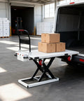 Heavy Duty Battery Powered Hydraulic Lift Table With Slide Rails For Trucks And Garages Offers 1100 Lb Capacity loading cargo boxes.