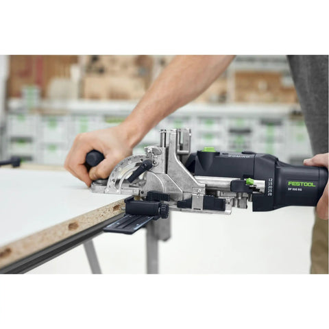 Person using Domino Joiner DF 500 Q Mortising Tool With 5mm Cutter Dial Width Adjust And Oscillating Cutting Action New Model on wood panel