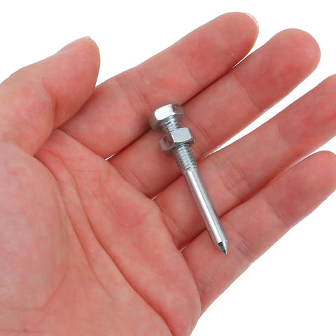 Hand holding a single heavy duty silver metal spike from 20 Pack Lawn Spikes For Aerator Shoes