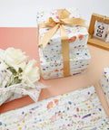 Flower Gift Wrapping Tissue Paper Set 100 Sheets Eco Friendly Recyclable Greenery Botanical Design For Weddings Birthday Showers Gift Wrap Ready Party Decor And Arts And Crafts Gift Packaging wrapping a gift with flowers and ribbon.