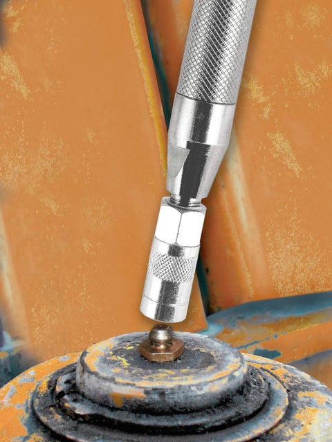 Close-up of a knurled metal grease joint rejuvenator tool attaching to a rusted bearing joint.