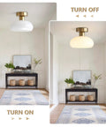 Mid Century Modern Bathroom Ceiling Light Small Black Milk Glass Drum Shade Semi Flush Mount in entryway, turned on and off view.