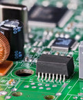 Close-up of electronic components on a 8x12 Inch Single Sided Copper Clad Laminate PCB Board for DIY etching and prototyping.