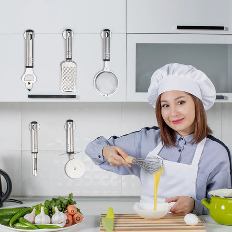 Neodymium disc magnets with double-sided adhesive, 4 pcs, mounted on white kitchen cabinets, holding utensils (front view)