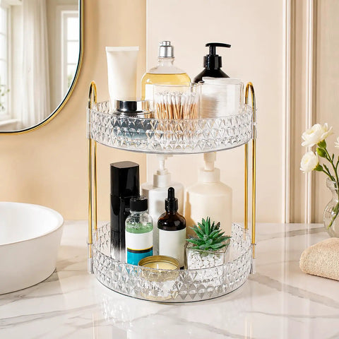 Two Tier Clear Rotating Makeup Organizer Stand Featuring Butter Smooth 360 Spin And Rock Solid Wobble Free Stability For Your Daily Skincare Routine With Reinforced Metal Base and clear cosmetic products displayed.
