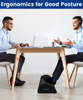 Two men seated at a table using an Under Desk Foot Rest With Soft Foam And Washable Removable Cover For Home Office And Car Use, Ergonomic Foot Stool To Keep Your Arches Supported, Improve Posture, Boost Circulation, And Help Ankles Relax While Seated.