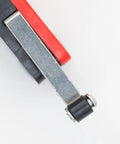 Close-up of V-156-1C25 Micro Limit Switch with Short Hinge Lever, showcasing SPDT Momentary Snap Action with red and black casing.