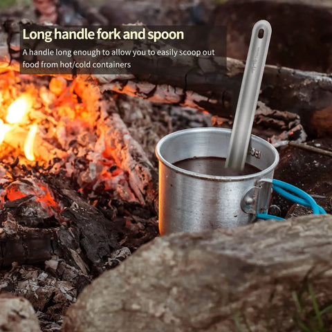 Ultra Lightweight Titanium Long Handle Spork And Spoon Set For Outdoor Camping And Backpacking in a cup near campfire