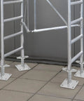 Four Pack Beefy Adjustable Leveling Jacks For Baker Style Scaffolding on solid carbon steel screw jacks, silver finish installed on tile