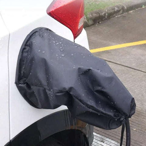 Magnetic EV Port Protector Hella Waterproof Plug Cover on EV, black canvas with rain droplets, universal fit for vehicle charging ports.