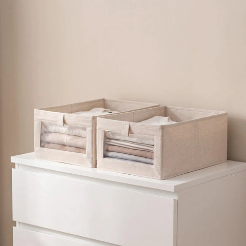 Sleek Foldable Cotton Linen Closet Storage Bins With Clear Window For Clothes Books And Toys Slick Multi Purpose Skinny Containers Easy To Pack Away No Sweat Home Organization Big Time Game Changer 3 Pack displayed on dresser.